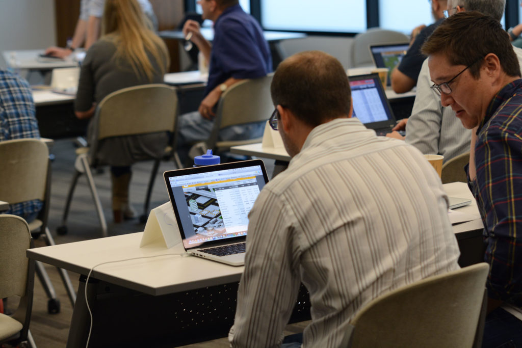 An employee engaged in a business simulation during the Building Business and Financial Acumen program 