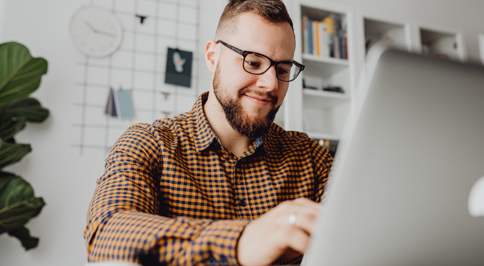 Young Male Manager Engaged In Virtual Training On Laptop