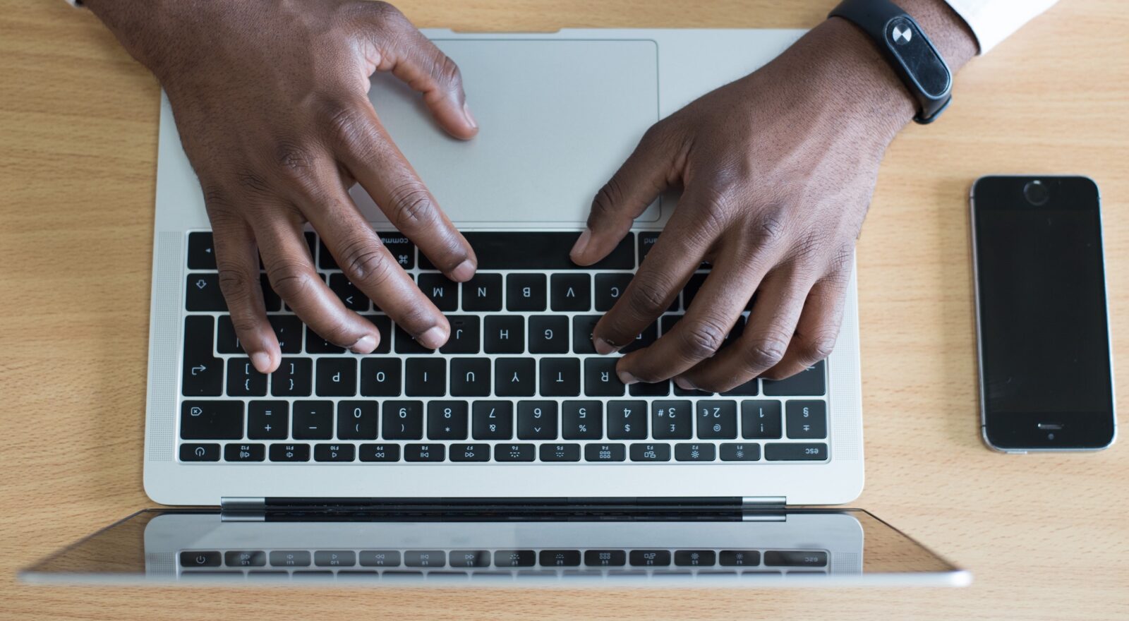 Man typing on laptop