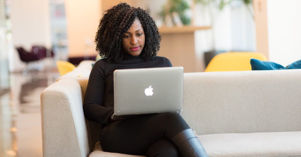 Female manager working on laptop from home