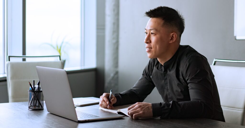 Man working on laptop in office