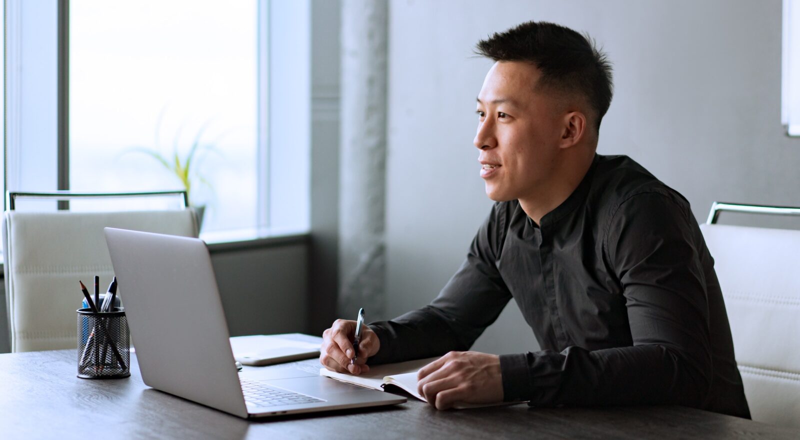 Man working on laptop in office