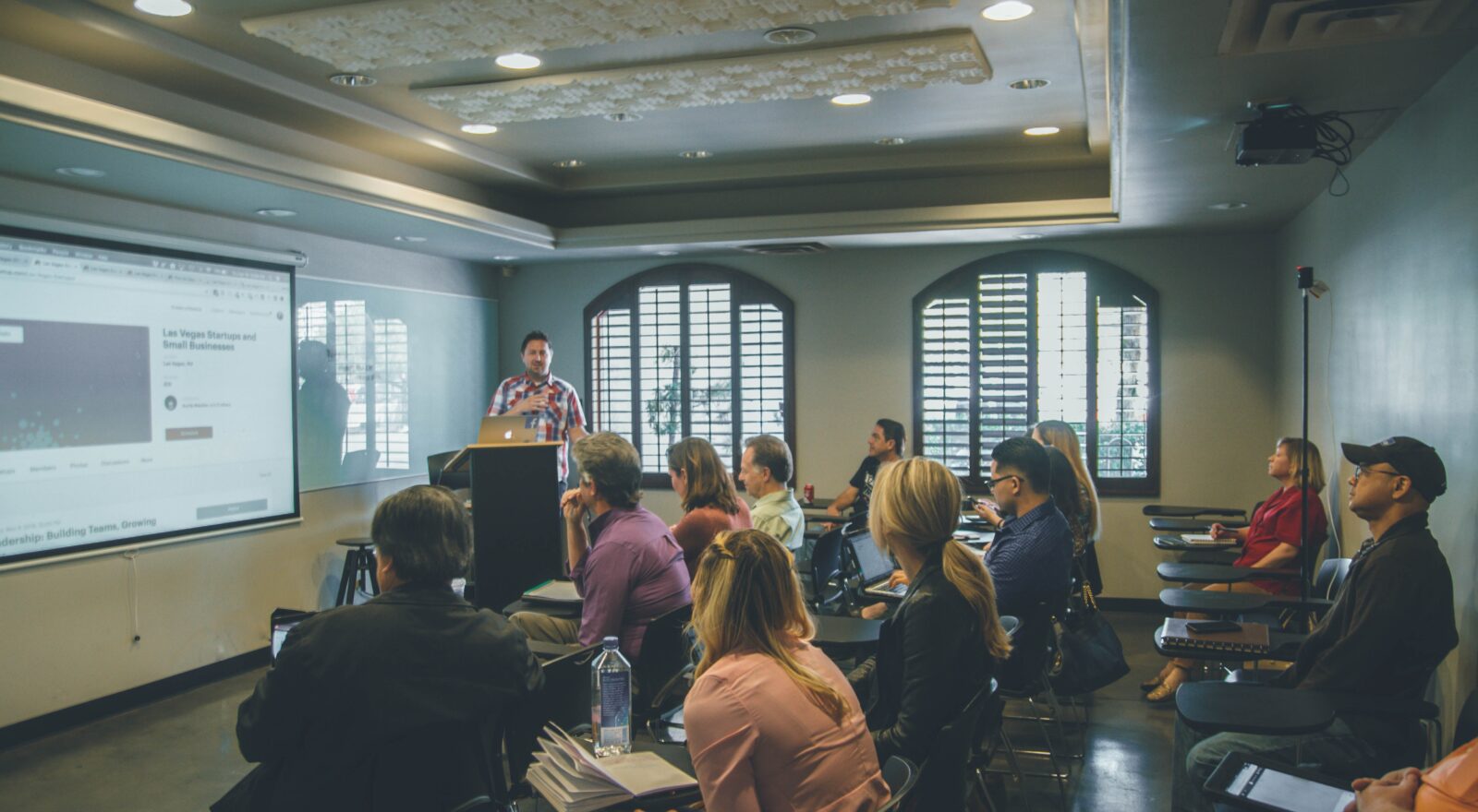 A group of professionals gathers for a corporate training